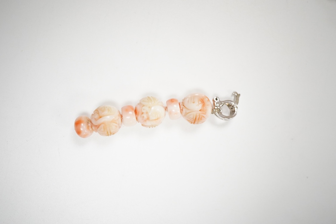 A 20th century adventurine quartz and coral bead set necklace, with a 925 clasp, 80cm, together with a similar carved coral line drop pendant, with a 750 white metal clasp.